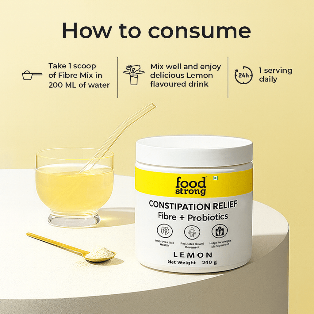 Container of 'foodstrong' constipation relief fibre and probiotics with lemon flavor, glass of lemon-flavored drink, and spoon on a light background.